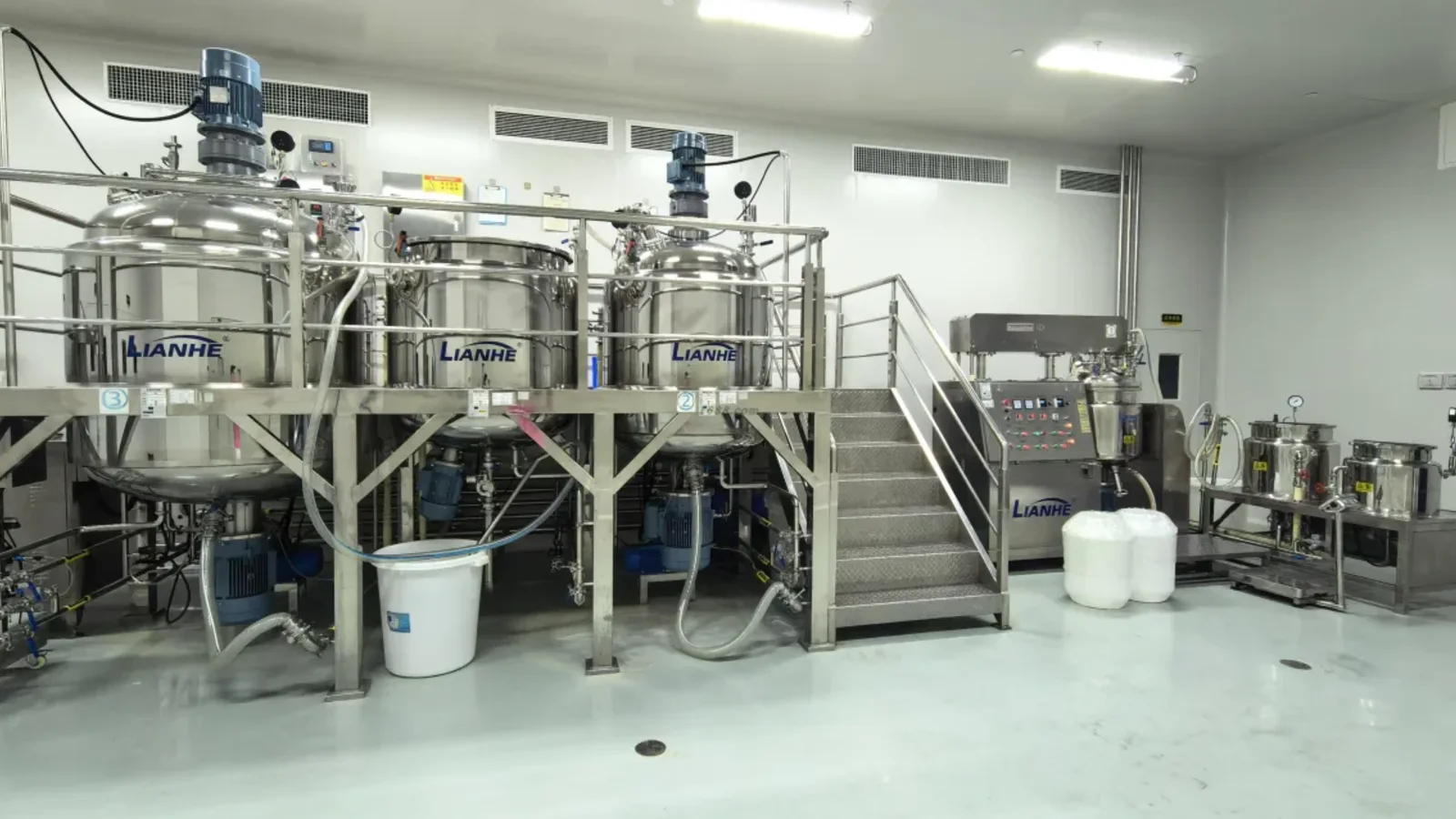Stainless-steel tanks used for perfume compounding, relevant to customer supplied perfume packaging